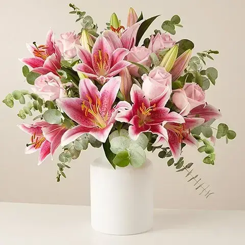 A fancy bouquet of lilies and roses